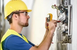 Licensed Electrician in Rocky Point, NY | RJ & Son Electric 15 Licensed electrician testing an electrical panel in Rocky Point NY