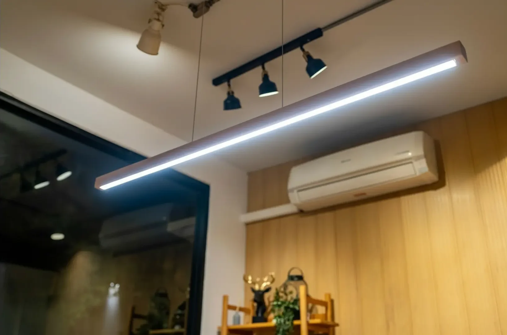 Linear LED fixture providing task lighting in a home office