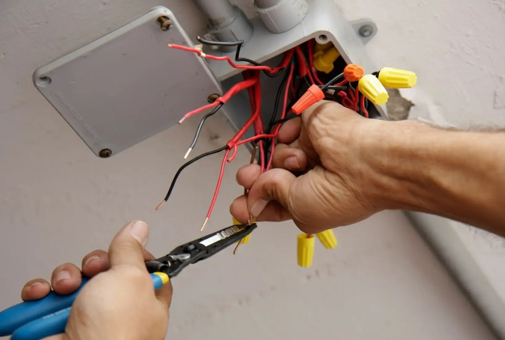 Emergency electrician repairing urgent wiring issue in Suffolk County NY